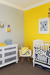 Yellow and gray baby room with white accents. Bright yellow accent wall, lemon yellow