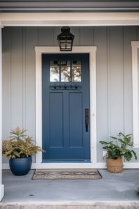 Create a coastal oasis at your gray house's entrance with 40 front door color ideas. #CoastalOasis #GrayHouse #FrontDoorColor