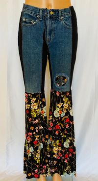 The most comfortable jeans you'll ever wear. One of a kind jeans with the Mama Mia ruffle will turn heads. Comfort and funky hippie style. Embellished with denim peace sign. These get noticed. SIZE XXS-L. You will need to size down. XXS - 0-4 XS-6-8 S- 8-12 M-12-14 L-16-18