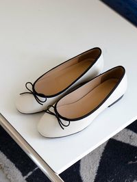 Editor's NotesNONETHELESS's simple and casual shoes will stand out your daily outlook.- Lovely ribbon point - Cute round shaped toe- Feminine and classic silhouette- Soft and durable leather textureMeasurements(in.)- Size: KR 220MM (US 5) - KR 255MM (US 8.5)- Heel Height: 0.39 in.*Fits true to the size.Composition & Care- Lambskin- Do not wash- Professional shoe cleaning is neededDesigner- by NONETHELESS