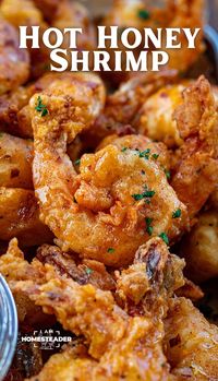 Hot Honey Fried Shrimp is large shrimp, deep-fried until nice and crispy, then tossed in homemade hot honey for a sweet and spicy kick to each bite! Serve as an appetizer with more hot honey for dipping. Or, enjoy the shrimp as the main course with a side dish or two. Any way you serve it, the shrimp will be a hit!