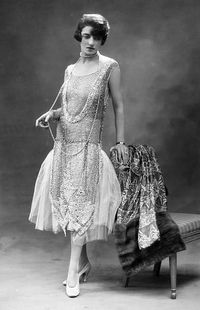 People Fashion. pic: 1926. Young woman in the evening wear fashion of the era.