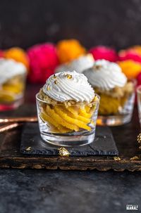 Badam Halwa Jars made with layers of rich and creamy almond halwa, mawa and nuts and topped with rose scented whipped cream.