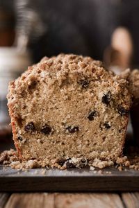 A simple, high altitude recipe for cinnamon raisin loaf cake, studded with plump raisins and spiced with cinnamon, with a buttery brown sugar crumb topping. With the moist, crumbly texture of sour cream coffee cake, this raisin cake is delicious served warm from the oven.