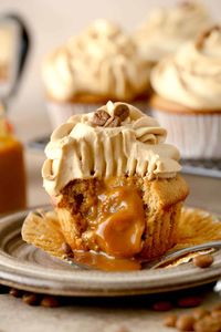 Coffee Cupcakes with Caramel Filling are at the top of the cupcake world for deliciousness. Light coffee-flavored cupcakes have an ooey gooey center and a light-as-air whipped cream icing. Perfect for any time of the day.