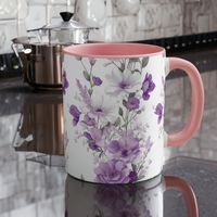 Bring a touch of nature into your home with this charming purple and white flowers mug. Whether you're enjoying your morning coffee or a hot cup of tea, this mug is sure to delight with its peaceful, floral design. Crafted from durable ceramic, it features a convenient handle for easy grip and handling. Order today and add a touch of beauty to your daily routine! Add some color to your routine with this two-tone, custom accent coffee mug. This 11oz mug features an accented C-Handle that is comfortable to use, as well as an accented interior to add more contrast and character. Microwave and dishwasher safe. .: White ceramic with colored interior and handle .: C-handle .: Eye-catching color contrast  .: Lead and BPA-free This product is made especially for you as soon as you place an order,