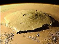 Olympus Mons ( Latin for Mount Olympus) is a large shield volcano on Mars. The volcano has a height of over 21.9 km (13.6 mi or 72,000 ft) as measured by the Mars Orbiter Laser Altimeter (MOLA). Olympus Mons is about two and a half times Mount Everest's height above sea level. It is the largest and highest mountain and volcano of the Solar System.