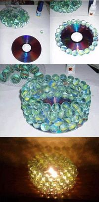 16 DIY Projects Using Old and Scratched CDs - Build a candle holder out of marbles and an old CD.