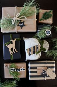 The perfect rustic gift wrapping ideas. I love the black, white and green. The greenery and wood and perfect natural elements!