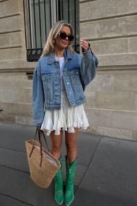 Style a white mini dress and denim jacket with green cowboy boots!