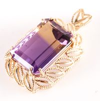 14k Yellow Gold Emerald Shaped Ametrine Solitaire Pendant 15.60ct 6.44gMetal Information: 14k Yellow GoldTotal Weight: 6.44gPendant Width: 20mmPendant Length: 33.2mmStone InformationMain StoneGem Type: AmetrineShape: Emerald (18mm x 13mm)Color: Purple / YellowClarity/Quality: ACarat Weight: 15.60ctNumber of Stones: 1Total estimated ctw (carat total weight): 15.60ctwEstimated Retail Price: $1240.00OUR PRICE: $990.0045476