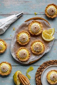 These easy individual mini lemon meringue tarts are made from scratch using pie crust, lemon curd, and a fluffy Swiss meringue topping. They're bright and tart with the perfect amount of sweetness. Break out the blow torch for this fun and delicious recipe!