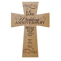 Honor the happy couple with a personalized 15th wedding anniversary maple wall cross. A treasured and lasting personal keepsake for a wedding or anniversary. The 15th Anniversary cross can be hung on the wall. These special keepsake crosses will always be a wonderful reminder of the love that you have for one another. The verse reads: God gave me you for all the ups and downs. 15th wedding anniversary Decorative Maple wood wall cross Made in the USA Can be displayed on Wall with laser engraved v