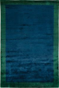 Handknotted from sumptuous Mohair yarns, this rug has a delightfully soft and springy texture underfoot. The Emerald colourway is crafted with a blue background and a contrasting green border.