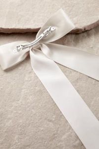 Add a touch of coquette to your outfit with this long satin bow. Features ribbon styling with a silver-tone snap-fastened hair clip. **Content + Care** \- Satin, Metal \- Wipe clean | Long Satin Bow Hair Clip - Cream at Urban Outfitters