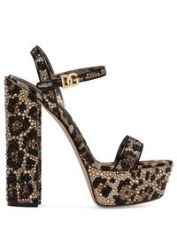 105mm leopard-print platform sandals from DOLCE & GABBANA featuring beige, black, all-over leopard print, crystal embellishment, buckle-fastening ankle strap, goatskin, branded leather insole, almond toe, open toe, high block heel and gold-tone logo plaque.