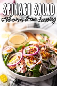 This classic spinach salad with warm bacon dressing is so easy to make! With sweet red onion, hard-boiled eggs, and tender mushrooms.