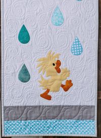 Bring back that childhood love of dancing in the rain with this cute little duck door banner. Welcome the rains of springtime to your own front door. Door banner quilt finishes at 16"x 50"