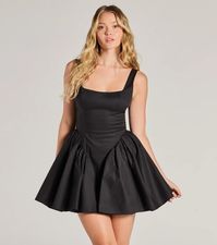 Channel your sugar and spice in this sleeveless skater dress at the school dance or dressy date!  Designed with a square neckline and shoulder straps for a flattering fit, this dress also boasts a low-cut back with a tie closure for an added touch of flirtiness. The skater silhouette and ruffled sides create a playful and feminine look, while the short-length hem offers a modern style. Complete the look with jewelry and a clutch!Fit & FeaturesPoplin woven fabric, woven lining with tulle trimSquare necklineShoulder strapsLow-cut back, lower zipper and hook-eye closureTie-back closureRuffled sides, skater silhouetteRuns true to size