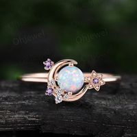 "This is a round 5mm lab opaL engagement ring in solid gold,  The accent stones are natural amethyst and diamonds or moissanites. The band width is about 1.4mm. It can be made in any ring size. However please contact me to custom make it to a special big or small size. It can be made in white gold,rose gold or yellow gold with 14k or 18k. However for some people who are nickel allergic,I can also make it to 925 sterling silver to make you can wear it. The ring is handmade,very high quality! 30 d