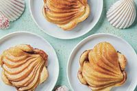 These sweet cinnamon pear tarts with puff pastry are made by coating pear slices in brown sugar and cinnamon mixture and baking them on top of tender puff pastry until golden. They're quick and easy to make but so elegant that they're certain to wow your dinner guests.