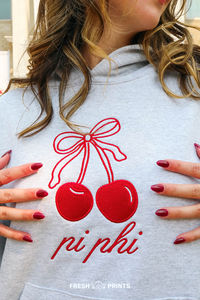 customize cute, trendy, and affordable merch for your organization with Fresh Prints! pi beta phi, pi phi, pi phi sorority, sorority merch, sorority apparel, sorority hoodie, sorority sweatshirt, embroidered sorority hoodei, embroidered hoodie, embroidered cherries, sorority merch inspo, trendy sorority apparel, cherry with bows, coquette cherry, coquette sorority merch, custom embroidery, pi phi hoodie, aesthetic outfit, cozy outfit, trendy hoodie, cool embroidered hoodie, gray hoodie, lounge