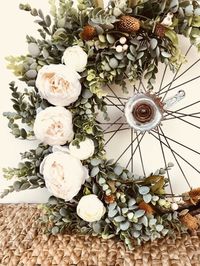 Vintage Succulent Bike Wheel Wreath with peonies, pine cones and eucalyptus.