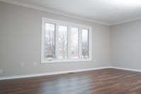 As one of the first rooms potential buyers will look at, this main floor living area needed to be welcoming.   Painting walls a neutral gray, and ceiling and trim a clean white created a gorgeous contrast, making this area feel light and fresh. #parliamentpainting #housepainting #residentialpainting #interiorpainting