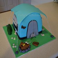 Camping Themed Birthday Cake I am a bit behind in posting cakes. I made this tent one back in April for a camping themed party. I wasn'...