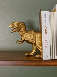 Dinosaur Bookends - Hamilton Park Home kids room, boys room, boys bedroom, dinosaur room, dinosaur bedroom, dinosaur theme, dinosaur bookends, diy bookends, bookends, gold dinosaur bookends, boho bedroom, sherwin williams rosemary, sherwin williams dried thyme, antique brass bed, green bedroom, green room, green paint, shelving unit, kids shelving unit, bookshelves, kids bookshelves, kids desk, ikea svalnas, ikea hack, ikea svalnas hack, modern vintage bedroom,