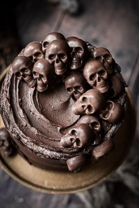 Chocolate skulls on a chocolate cake for Halloween.