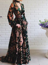 Details - Dark green color  - Velvet fabric - Wildflowers all over the dress - A-line with long sleeves and an open leg - For special occasion