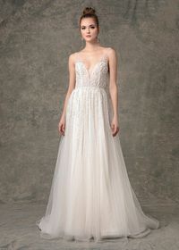 The meadow wedding dress is a deep V neck A-line gown with delicate bead work on bodice cascading onto skirt. #weddingdress #weddingdresses #romanticbride #alineweddinggown #bridalballgown #weddingown #bridalgown