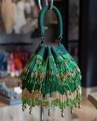 Made by an incredible Mexican designer. This elegant purse is a masterpiece that gives us the perfect mix between the different shades of green with some golden details. Elevate your outfit with it and shine even brighter!✨✨✨⁠ ⁠ Visit our Montage boutique to shop this incredible bag and more!