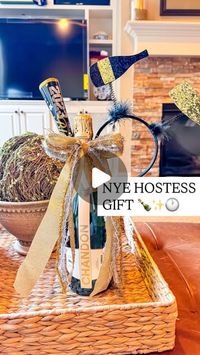 Shelby Parks on Instagram: "A non-yawn NYE hostess gift idea! 

All you’ll need is:
• A bottle of champagne 
• Party horn 
• NYE headband 
• Rubber band

Tie it all together with a festive bow & now you have a cute and easy NYE hostess gift 

*Comment NYE to get the supplies I used & a link to the birthday version sent to your inbox 💌
•
•
•
#hostessgift #hostessgifts #nye #newyearseve #nyeparty #giftideas #giftidea #diy #howto"