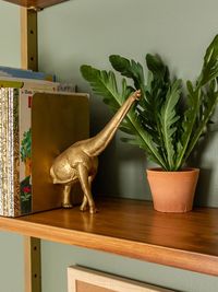 Dinosaur Bookends - Hamilton Park Home kids room, boys room, boys bedroom, dinosaur room, dinosaur bedroom, dinosaur theme, dinosaur bookends, diy bookends, bookends, gold dinosaur bookends, boho bedroom, sherwin williams rosemary, sherwin williams dried thyme, antique brass bed, green bedroom, green room, green paint, shelving unit, kids shelving unit, bookshelves, kids bookshelves, kids desk, ikea svalnas, ikea hack, ikea svalnas hack, modern vintage bedroom,