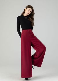 "Discover contemporary winter chic in our burgundy wide-leg high-waisted wool pants. Crafted with care from luxurious wool, these full-length trousers offer the ultimate combination of fashion and warmth. Their wide-leg silhouette adapts to various occasions, and the deep wine-red shade radiates timeless elegance. Whether you're headed to work or a festive event, these wool pants ensure you're both stylish and cozy. DETAIL * 30% wool blend, 40% fiber and polyester, 40% nylon * Full polyester lining * Two side pockets * Zipper and button front closure * Wide leg pants * High waisted Pants * Perfect for summer, autumn and spring * Dry clean MODEL SIZE Bust 85 cm(33.4\") Waist 67 cm(26.7\") Height 168cm (5' 6\") She wears size XS Choose CUSTOM Order if you * Need a better fit * Can't find you