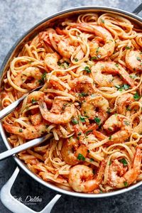 Linguini pasta gets a delicious make over with this 15-Minute Creamy Tomato Garlic Butter Shrimp! A quick and easy flavourful dinner in minutes!