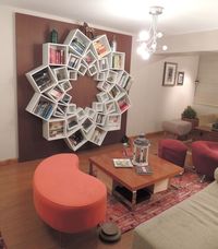 Book shelf out of square boxes arranged in a circle. 3 different sizes