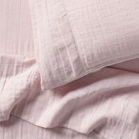 Our Supersoft Organic Cotton Gauze Pillowcase adds the finishing touch to any kid's bed. It's crafted using a double-layer weaving technique to create pockets of air that hold warmth. And the beautiful mauve rose hue makes a so-sweet color statement that will never go out of style.     100% organic cotton gauze, grown without chemicals or pesticides  Passes OEKO-TEX® STANDARD 100 textile safety tests  Cotton gauze provides breathability and softness  Double-layer weaving technique for warmth  Pi