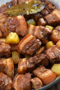 Pork Belly Hamonado cooked low and slow in pineapple juice and soy sauce. Melt-in-your-mouth tender with a sweet and tangy sauce, it's amazing over steamed rice and a guaranteed family favorite.