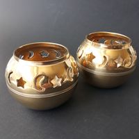 Set of Two Vintage Brass Tealight Candle Holders in Moon or Star Pattern. Small Brass Votive Candleholders. Thick and Sturdy Brass. Patina. Preowned. Good Vintage Condition. Measurements: Hight - 6.5 cm (2.55") Width at the widest point - 8 cm (3.14") Weight for Set of Two - 250 g All orders are sent as registered packages with tracking numbers. Thank You for visiting Funvintageera!