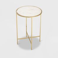 This round accent table set is the perfect answer for small living spaces. Everyone can use an extra table around the holidays or for unexpected guests, but when space is the issue, this small end table is a welcome choice. The white marble tabletop is a sure sign of excellence. The gold metal legs have a pleasing design that never goes out of style. This foolproof side table for small spaces can hold drinks for your guests and display your favorite table lamp and living room decor. This modern-