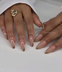 Elevate your summer style with these stunning almond-shaped nails featuring a gold French tip and a delicate crescent moon accent. Perfect for a touch of glam!  #SummerNails #GoldFrenchTips #AlmondNails #NailArt #Manicure #NailInspiration #SummerVibes #NailGoals #NailDesigns #Beauty #Fashion