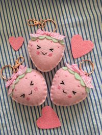 Valentine's is coming up! This Strawberry felt keychain is the perfect gift for your loved one, a friend, or for yourself! The Strawberry is entirely hand sewn, with a sweet little expression on it's face and a pink gingham bow on the top 💕🍓  Can be clipped onto a backpack, lanyard, bag, or wherever you wish! The keychain is rose gold. Each Strawberry is hand made, therefore there may be very slight differences from the photos. If you have any questions please feel free to message me!