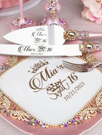 Add a touch of elegance to your quinceañera celebration with this exquisite pink iridescent cake knife and server set, perfect for cutting and serving your delicious cake. The shimmering iridescent finish makes this set a stunning addition to your dessert table, creating a memorable moment as you share the first slice with loved ones.  pink iridescent, quinceañera, cake knife, server set, celebration, dessert table, iridescent finish, glamorous, memorable moment, party accessory