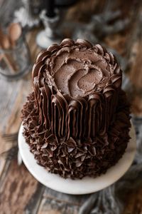 A high altitude tested recipe for the best chocolate cake, baked in a mini tiered wedding cake with 6 and 4 inch cake layers.