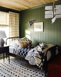 After serving as a guest bedroom, then playroom, this room became our son's "big boy" room in early 2020. We went all out with green paneling and a rustic wood ceiling. Everything from the car prints to the Ikea hack closet was picked with our son's interests in mind. Our star loving boy and aspiring builder picked out the bedrooms main light fixture himself!