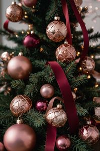 Indulge in luxury with a burgundy and rose gold-themed Christmas tree. It’s a beautiful combination for a warm, sophisticated holiday look.