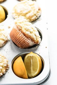 Lemon muffins with a streusel topping are like rays of sunshine on a winter morning ~ these muffins are light, tender and so delicious! #muffins #lemon #streusel #breakfast #recipe #easy #onebowl #best